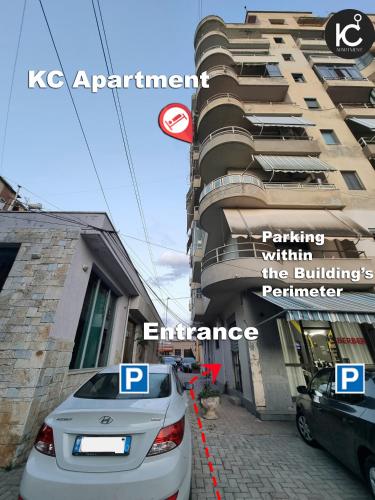 a car parked in front of a building at KC Apartment 1 in Berat