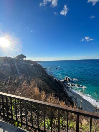 a view of the ocean from a balcony at Piccola Mansarda in Parghelia