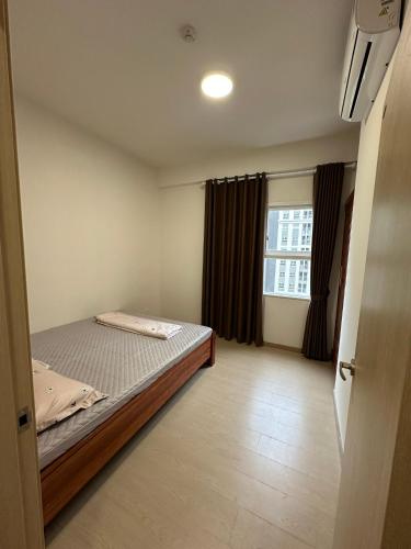 Ένα ή περισσότερα κρεβάτια σε δωμάτιο στο BeeHome