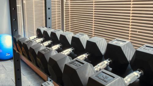 a row of gray dumbbells in a gym at Kleopatra Dreams Beach Hotel in Alanya