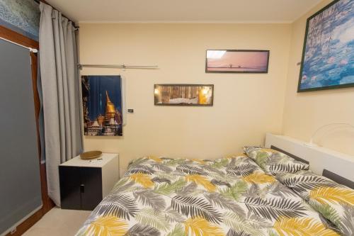 a small bedroom with a bed and a window at Tenuta Santa Tecla in Acireale