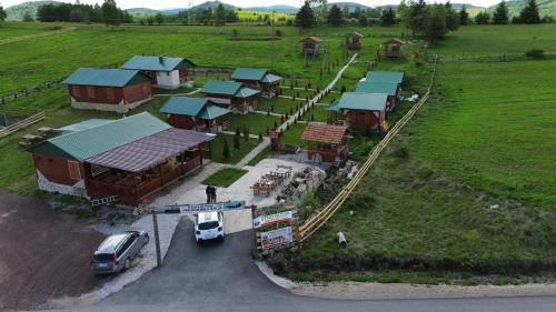 an aerial view of a farm with a truck parked in front at Etno meandri Uvca in Sjenica