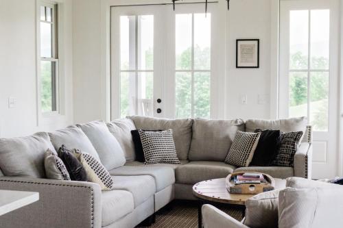 a living room with a couch and a table at Kaya Cottages in Dahlonega