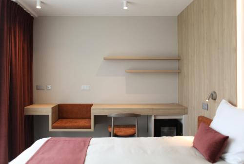 Postel nebo postele na pokoji v ubytování Hôtel Les Fines Gueules