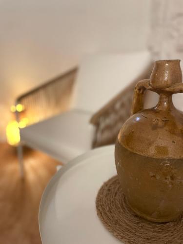 a vase sitting on top of a table at Casa Mia in Mola di Bari
