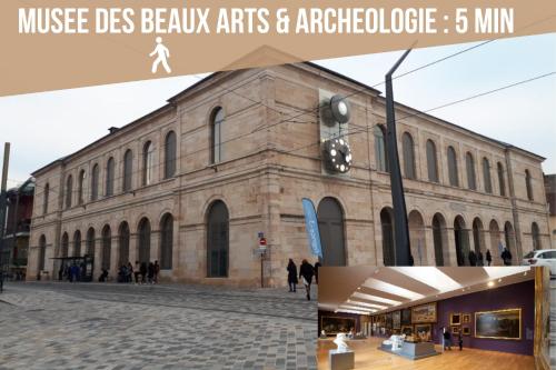 a large brick building with people walking in front of it at Hypercentre calme - Le Gatsby - Coconhome in Besançon