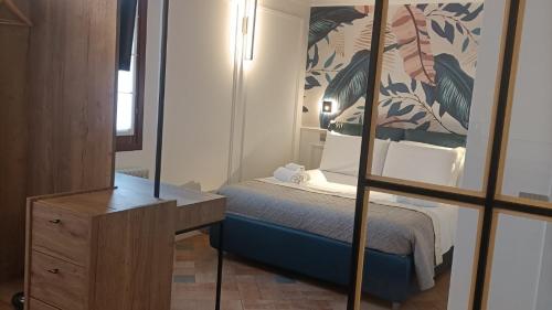 Voodi või voodid majutusasutuse Locanda Ca' Leon - Ferretti Hotels Collection toas