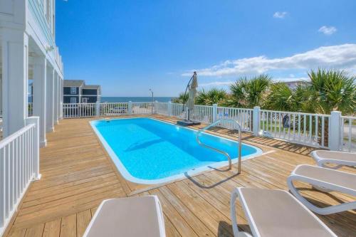a swimming pool on the deck of a house at Starboard Side in Oak Island