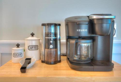 a coffeemaker sitting on a counter next to other appliances at Starboard Side in Oak Island