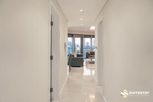 a hallway leading to a living room with views of the city at Fashion avenue Dubai Mall -The Residence in Dubai