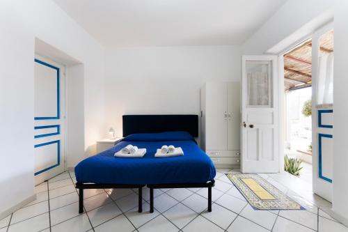 Posteľ alebo postele v izbe v ubytovaní Margherita House