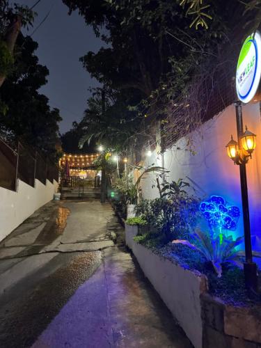 a street at night with lights on a wall at Viewleaf Resort Hotel in Marikina