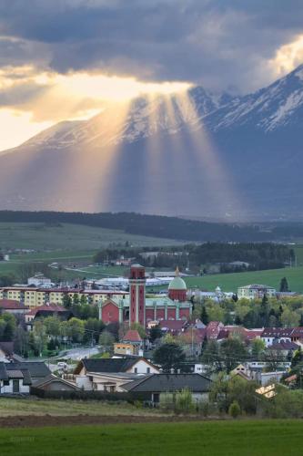 a view of a city with a mountain in the background at Luxus apartmán pod hradom in Kežmarok