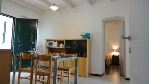a dining room with a table and chairs at Villa Vento Largo, Casa Irene in Ventimiglia