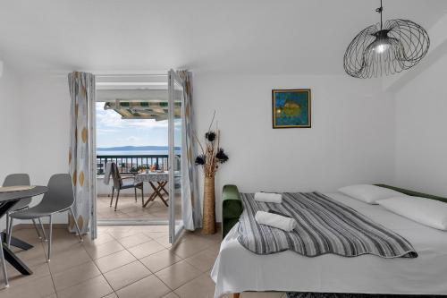 Postel nebo postele na pokoji v ubytování Apartmani Vanda