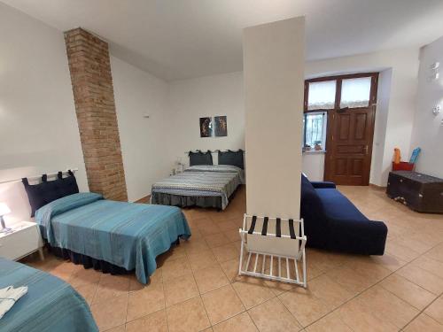 Postel nebo postele na pokoji v ubytování B&B Cala Seggiola