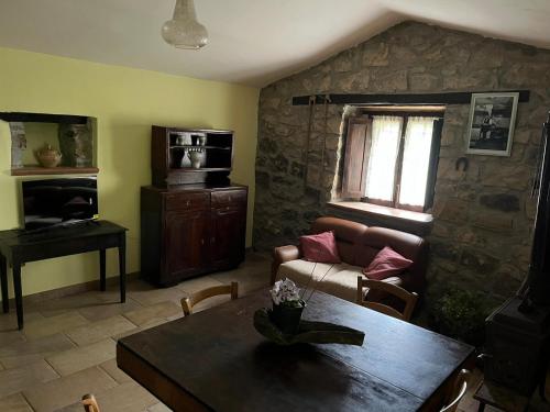 a living room with a couch and a table at A casa di Giovanni apartment in Albano di Lucania