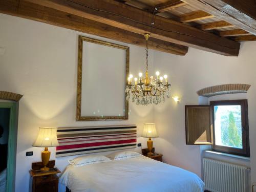 Postel nebo postele na pokoji v ubytování Casina di Leonardo Arezzo