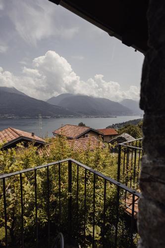 a view from a balcony of a house and a lake at Agriturismo Treterre in Pianello Del Lario