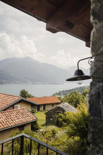 a view of a lake from a house at Agriturismo Treterre in Pianello Del Lario