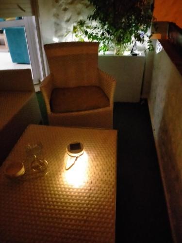 a table with a chair and a box with a ring on it at assilah marina golf assilah in Asilah