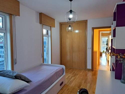 Ένα ή περισσότερα κρεβάτια σε δωμάτιο στο Apartamento en Rianxo La Morenita