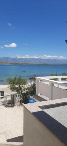 a view of the ocean from the balcony of a house at Apartman Mara in Vir