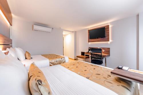 Postel nebo postele na pokoji v ubytování Sleep Inn Tijuana