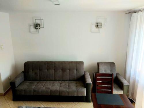a living room with a couch and a table at House in Zabierzów in Zabierzów