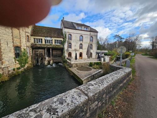 an old building next to a canal in front at Villa Rustic in Coulours
