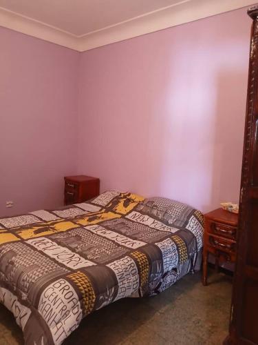 Llit o llits en una habitació de Maison Bouzedjar