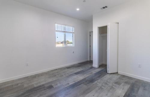 an empty room with white walls and a window at Ktown Homestay in Los Angeles