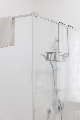 a shower with a glass door and a shower at Affittacamere Casa Emilia Foresteria Lombarda in Ponte San Pietro