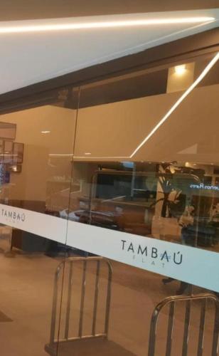 two chairs are sitting in front of a window at hotel tambau flat particular 605 in João Pessoa