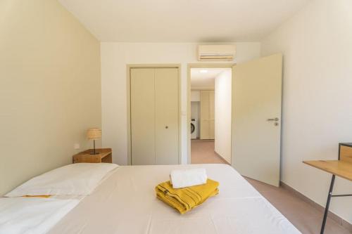 Voodi või voodid majutusasutuse Appartement Macaron Clair toas