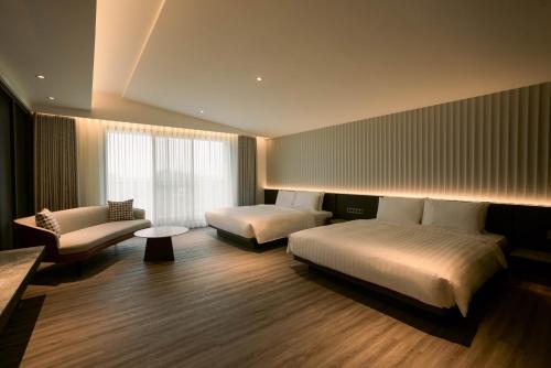 Una cama o camas en una habitación de XIUXI Anping Hotel