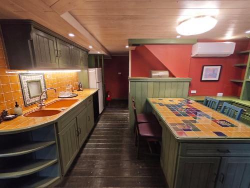 a kitchen with a sink and a counter top at 金石新月光 Gold Stone Crescent Moon Light in Jiufen
