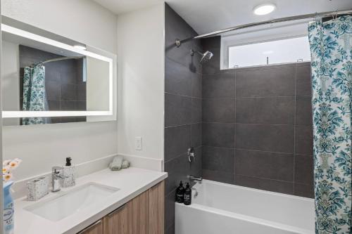 a bathroom with a white sink and a shower at 11 Best Walk location of SM in Los Angeles