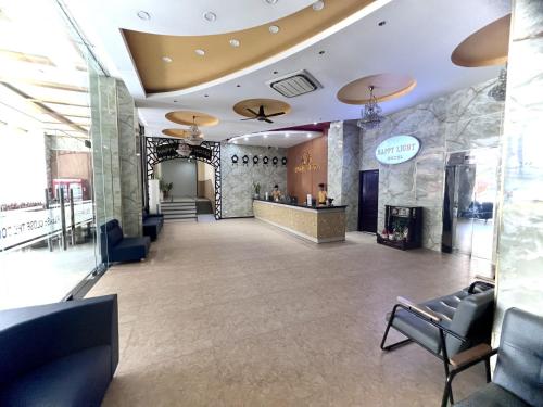 a lobby of a salon with chairs and a counter at Happy Light Central Nha Trang in Nha Trang