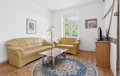 a living room with a couch and a coffee table at Ferienwohnung Nicole in Gurvitz