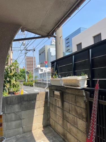 a view of a city street from a balcony at LAZYHOUSE 別邸 in Okayama