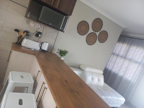 a small kitchen with a wooden counter top at TALITHA'S SELF-CATERING ACCOMMODATION in Walvis Bay