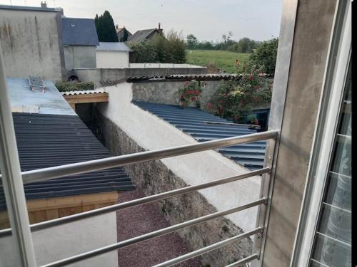 a view from a window of a roof at Poisson in Isigny-sur-Mer