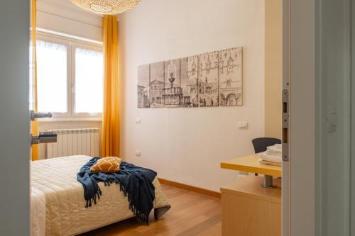 Postel nebo postele na pokoji v ubytování WellStay Perugia Downtown