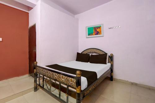 Posteľ alebo postele v izbe v ubytovaní SPOT ON Hotel Aaraadhya Residency