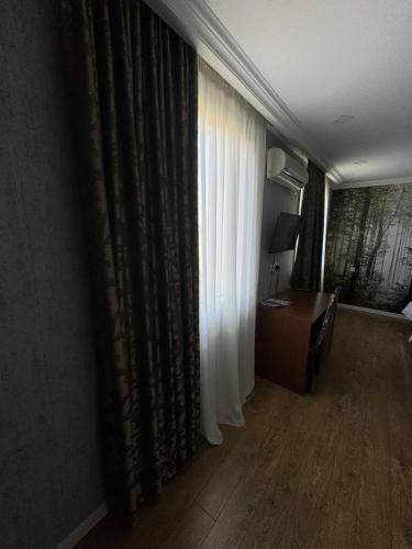 TV a/nebo společenská místnost v ubytování Hotel Kalanga