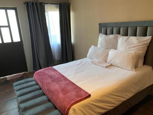Postel nebo postele na pokoji v ubytování King of J Guesthouse