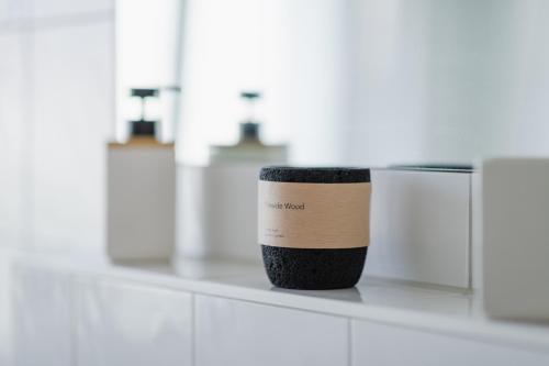 a coffee cup sitting on a counter in a bathroom at Spa Apartment am Bauhausmuseum in Dessau