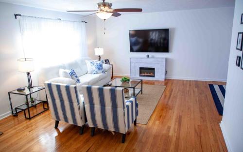 a living room with a couch and a fireplace at Cozy 3 Bedroom Home in Reynoldsburg