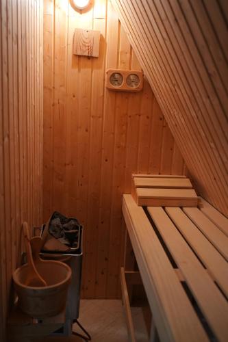 a sauna with a tub and a sink in it at Vila Zeleno borje in Žabljak
